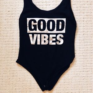Black “good vibes” leotard